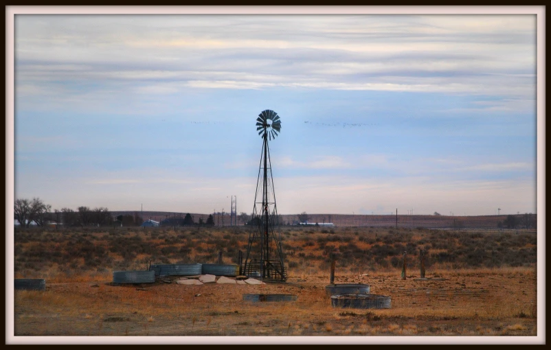 an old radio tower is in the middle of nowhere
