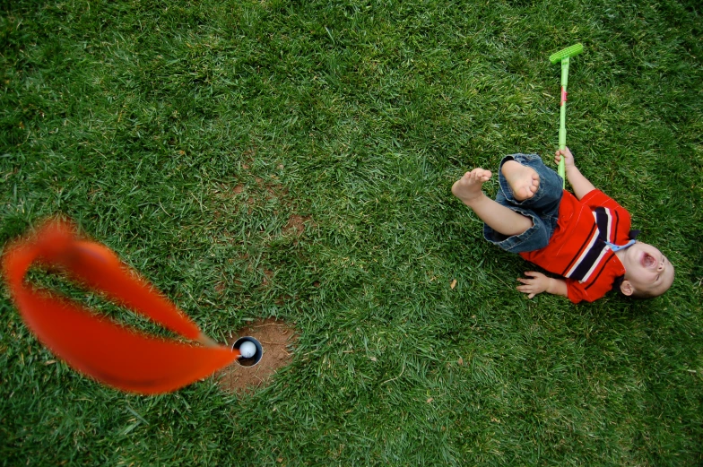 a  holds up a baseball bat in a field