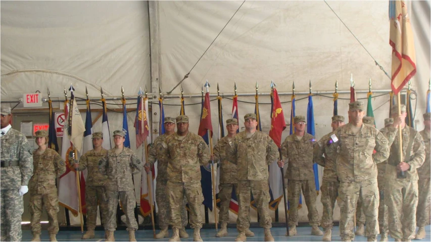 a group of military men standing around each other