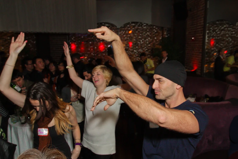 several people and a man at a dance