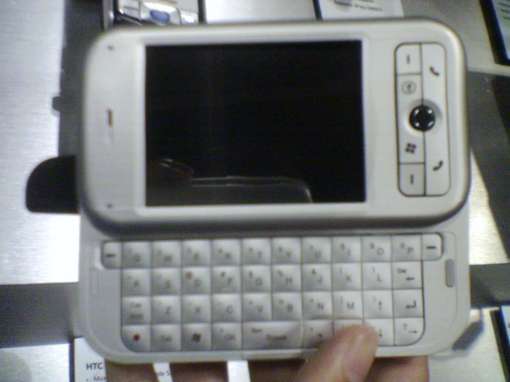 a man holding a white nokia cell phone