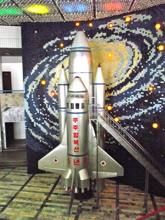 a model space shuttle that is on display in a building