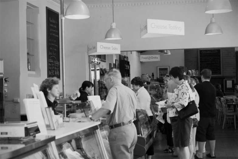 a group of people standing in front of a counter