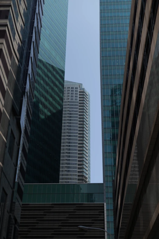 an image of looking at skyscrs from the ground