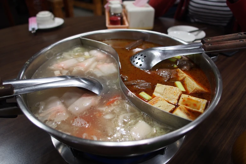 a metal pot with food inside of it