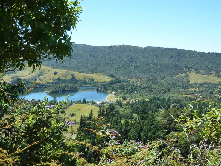 a view over a valley and lake in the mountains