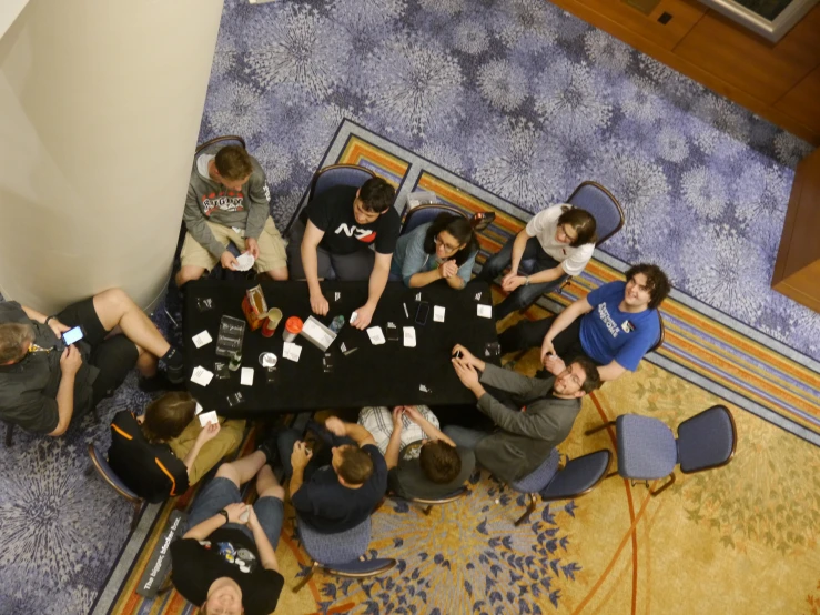 a large group of people seated at a table