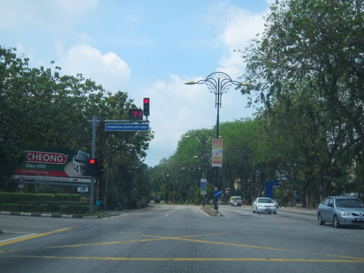 a city street has cars driving down it