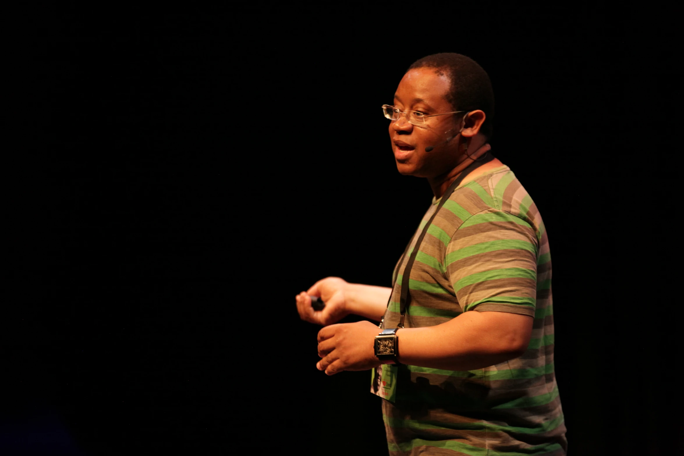 a man on stage with a microphone