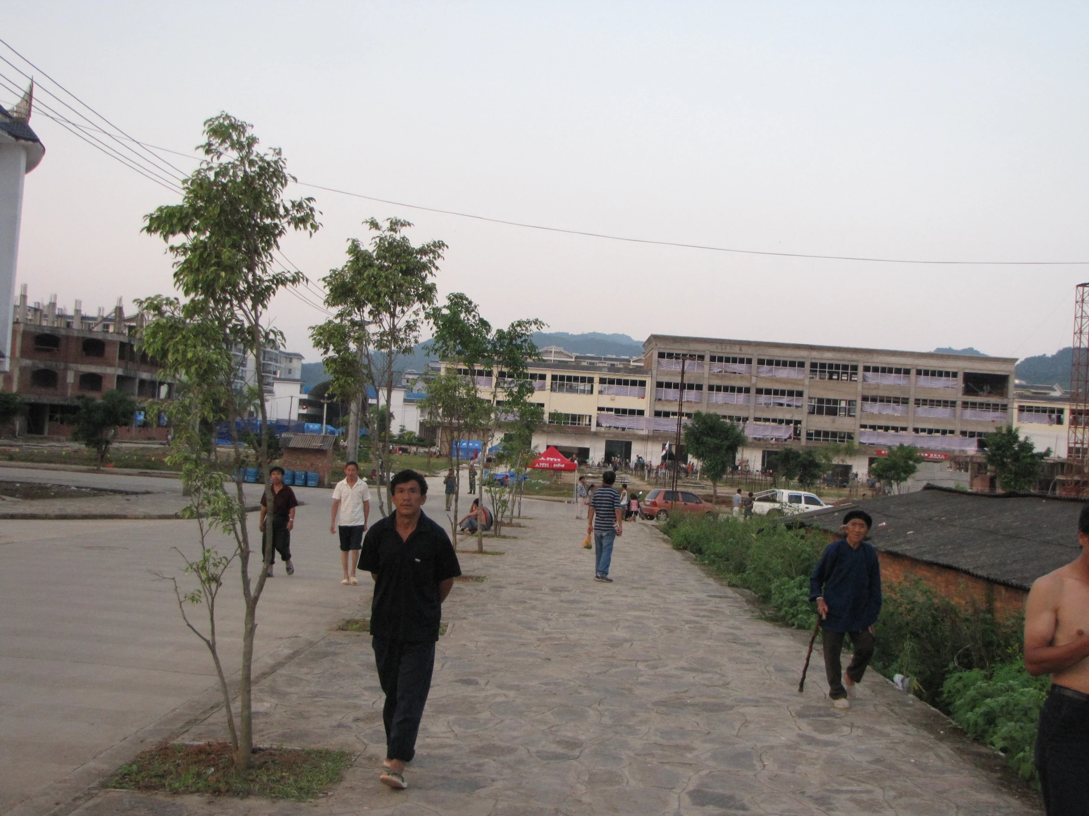 people walking down a path in the city