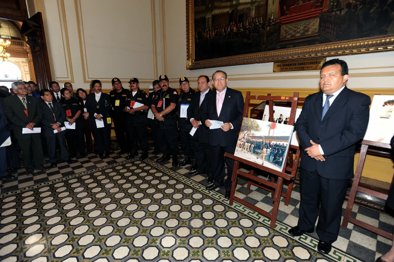 four men are standing with each other in suits