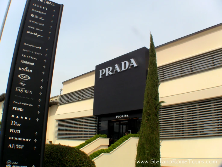 an exterior view of a building with a street sign