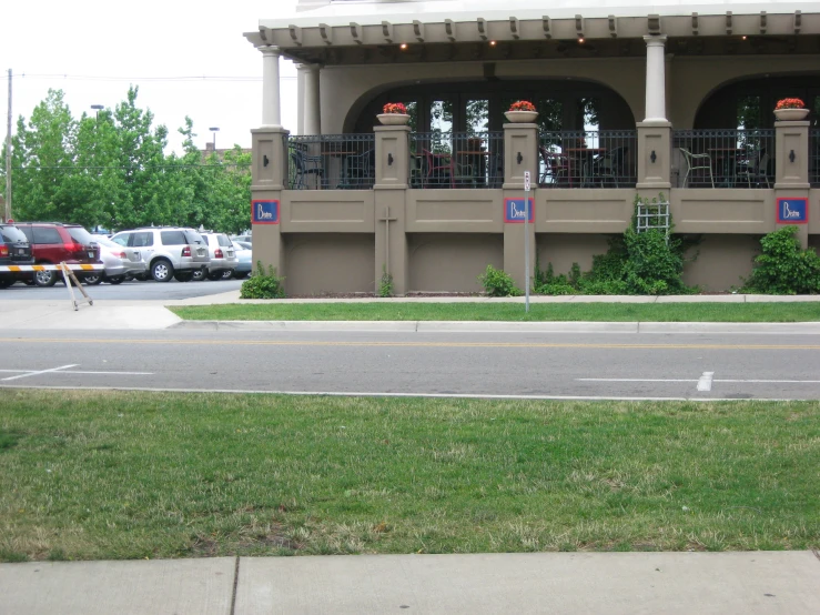 a parking lot next to a brown building