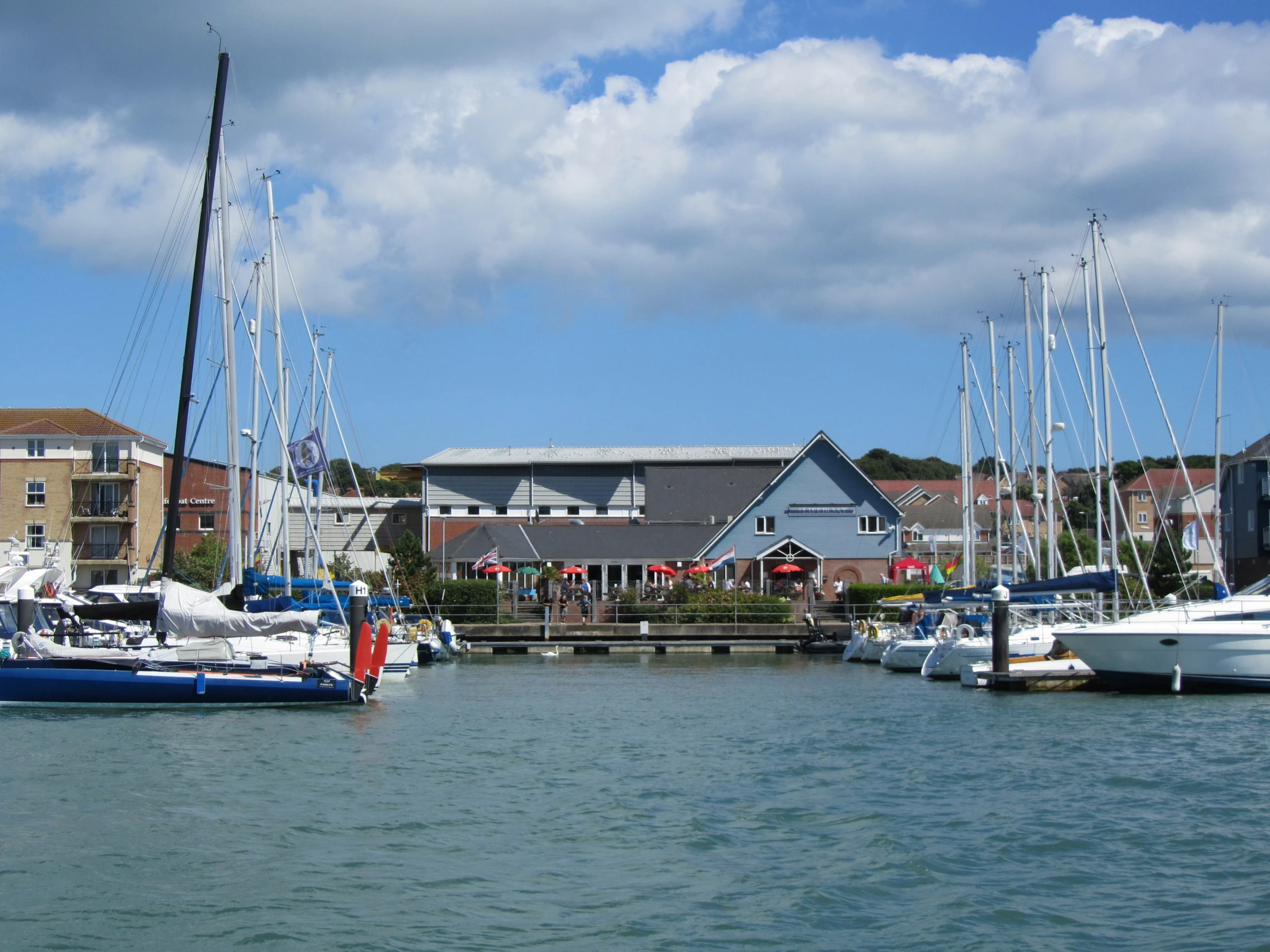 several sailboats tied up in a large body of water