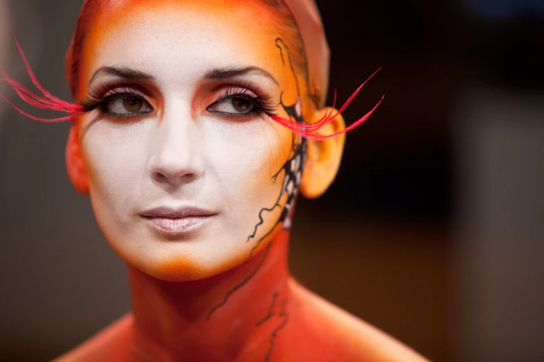 a close up of a face with many strange hair colors