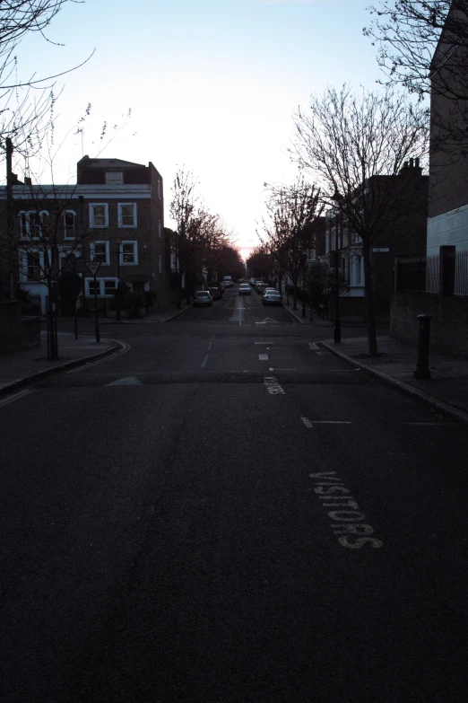 the city street is empty and very quiet at sunrise