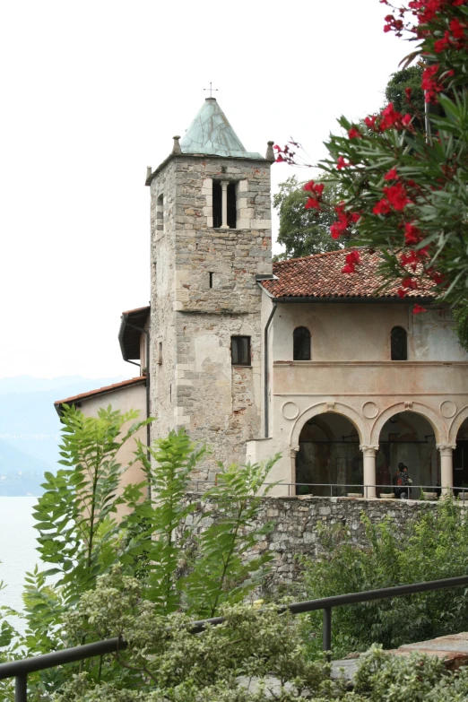 a stone building with a pointed clock tower