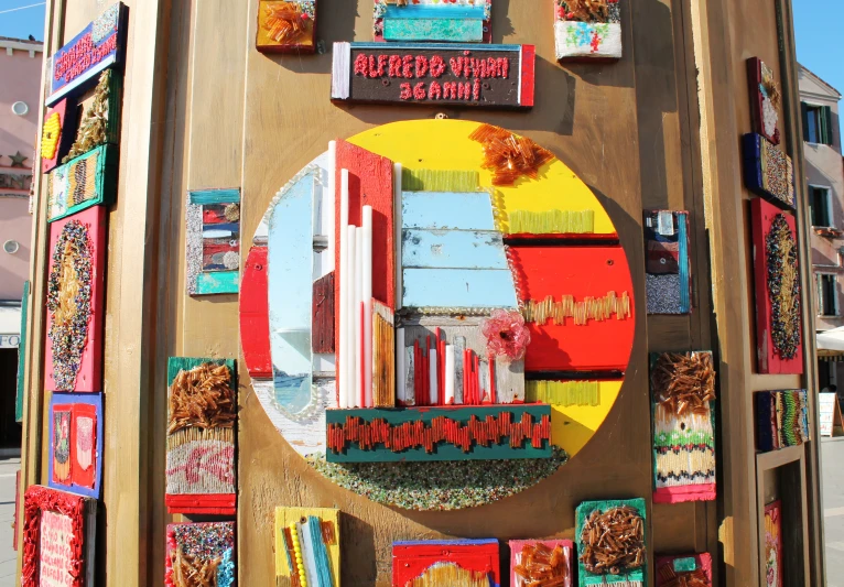 a colorful door is covered in a colorful decoration