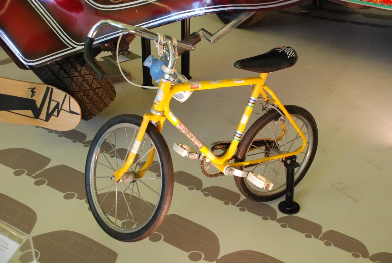 there is a yellow bike with no back tire in the shop
