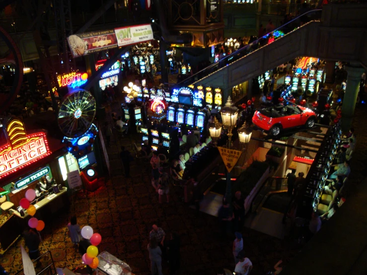 overhead s of a casino at night with bright lights and neon signs