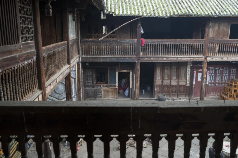 a building with balconys has a porch and a balcony