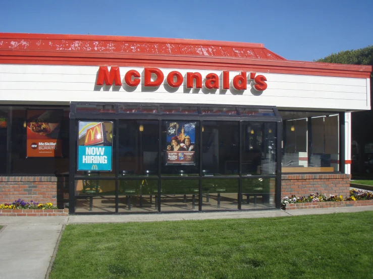 a mcdonald's store with a very tall sign