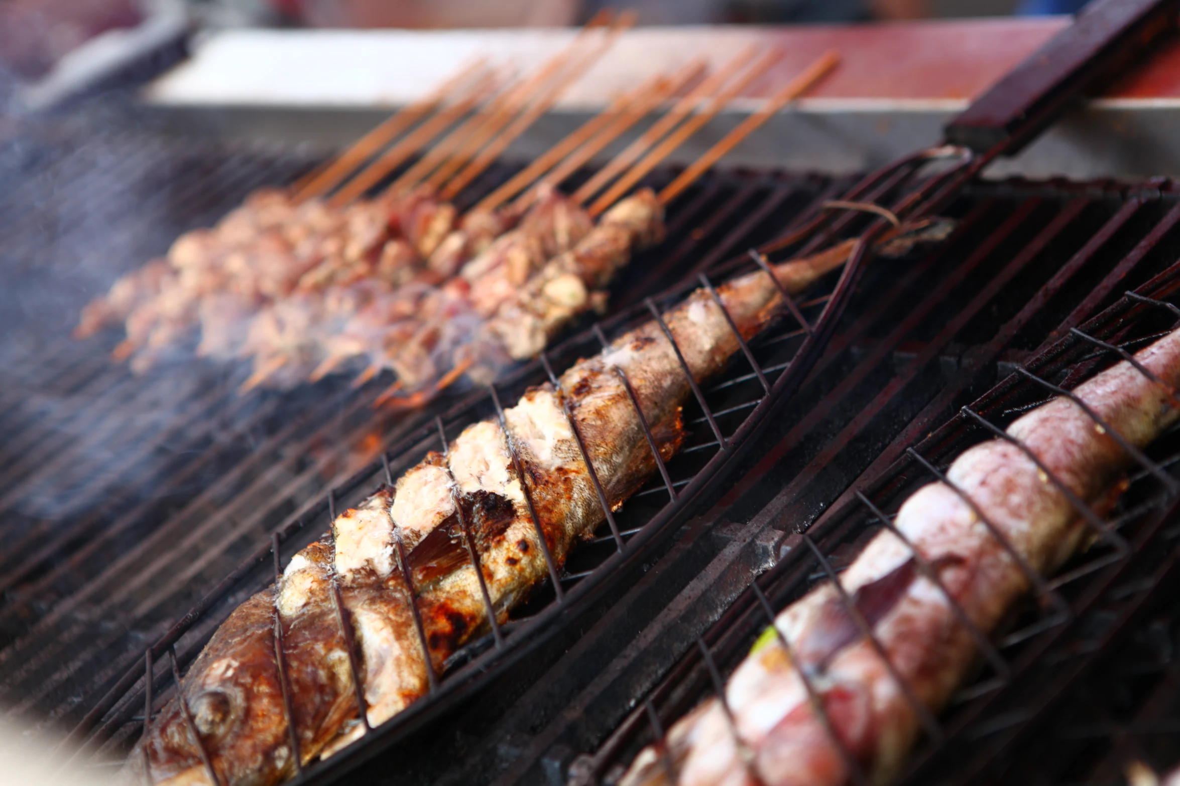 grilled meats on the grill with various toppings