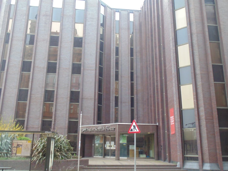 a large building with several floors and lots of windows