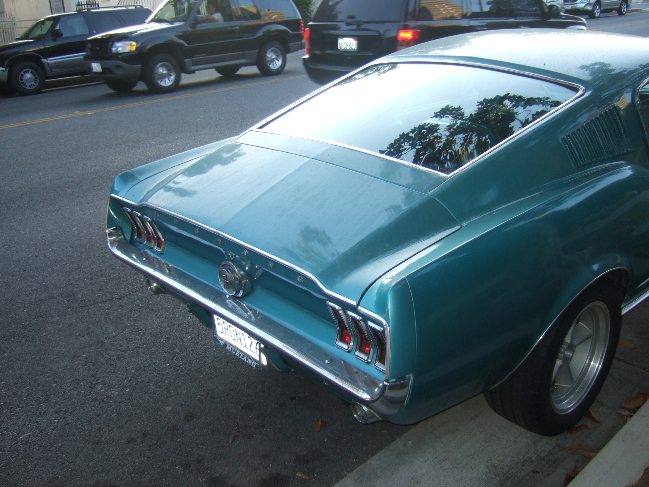 an old mustang muscle on the street