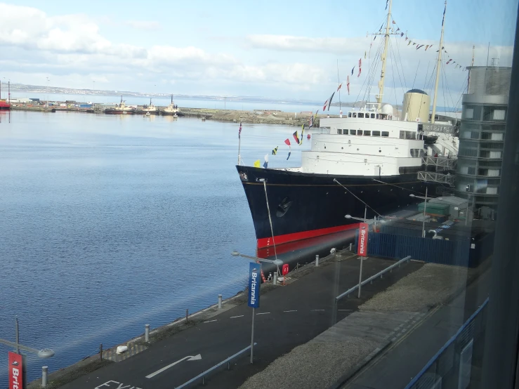 a ship in the harbor surrounded by water