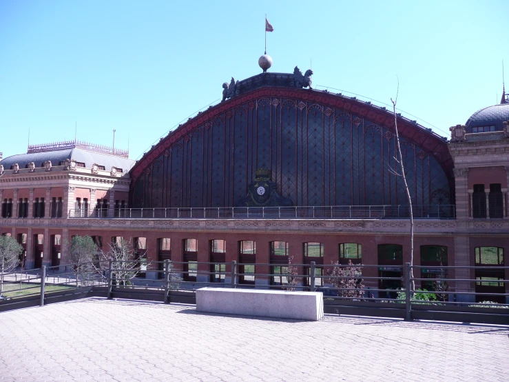 an architectural building with the flag flying