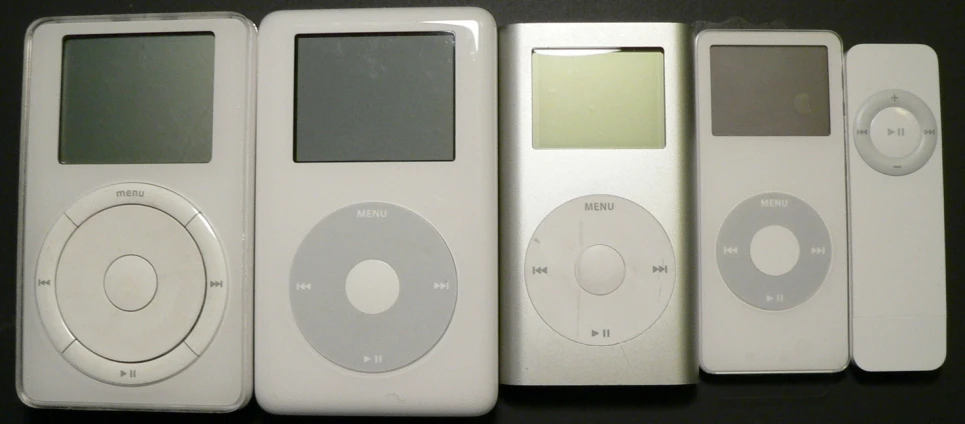 three new ipods, each in the same color and size, lined up next to each other