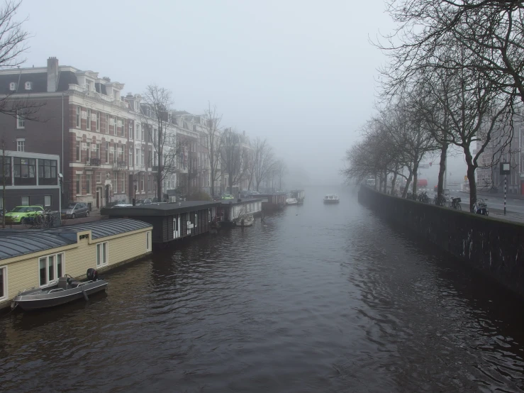 a row of houses on the river in a city