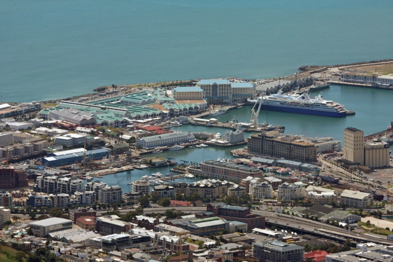 a port with some boats on the water and two ferries