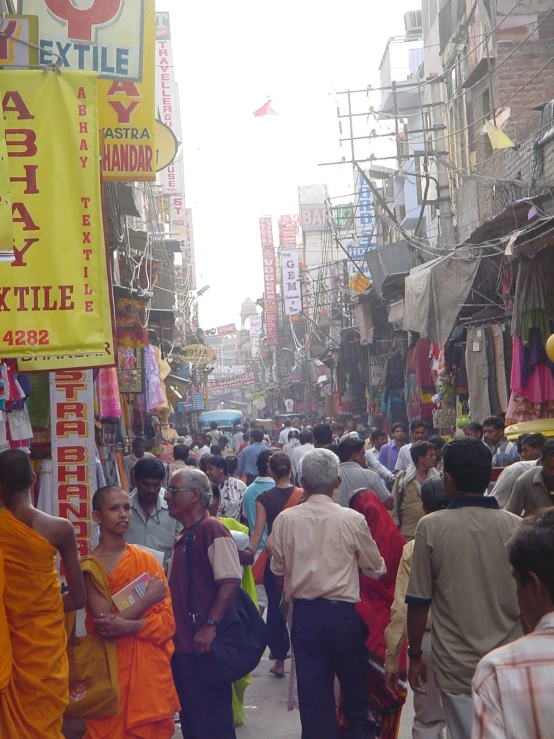 there are many people walking on the street together