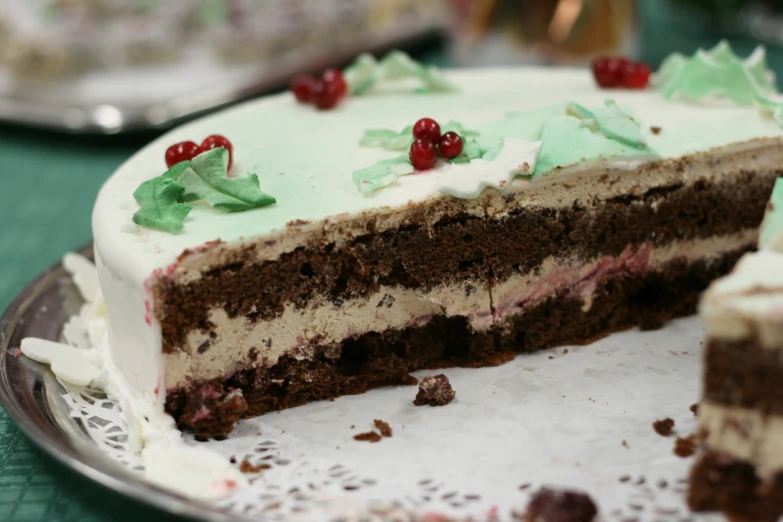 a close up of a cake with one piece taken out