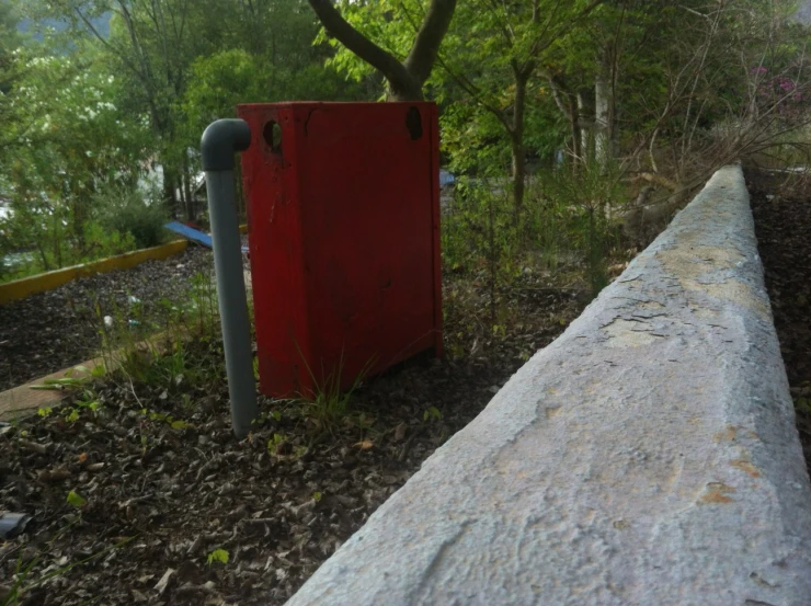 a wooden box is shown at the edge of a path