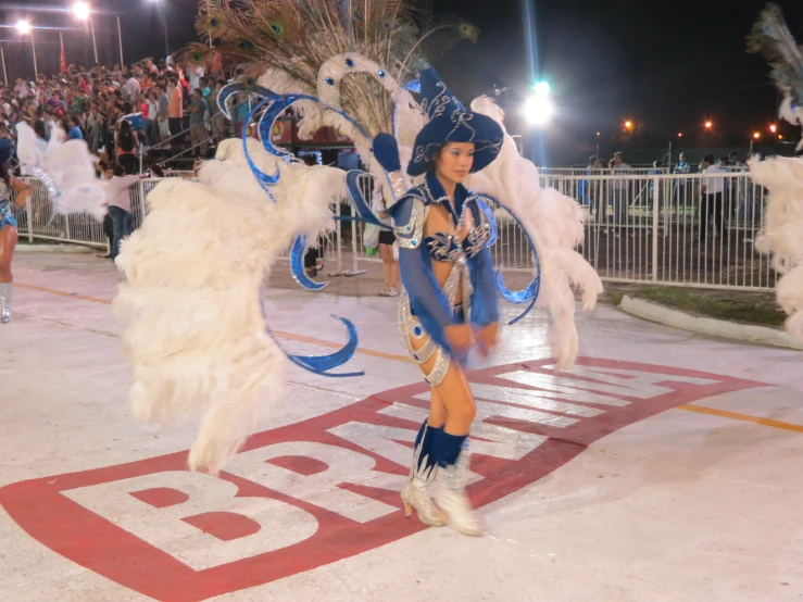 a woman in a blue and white costume