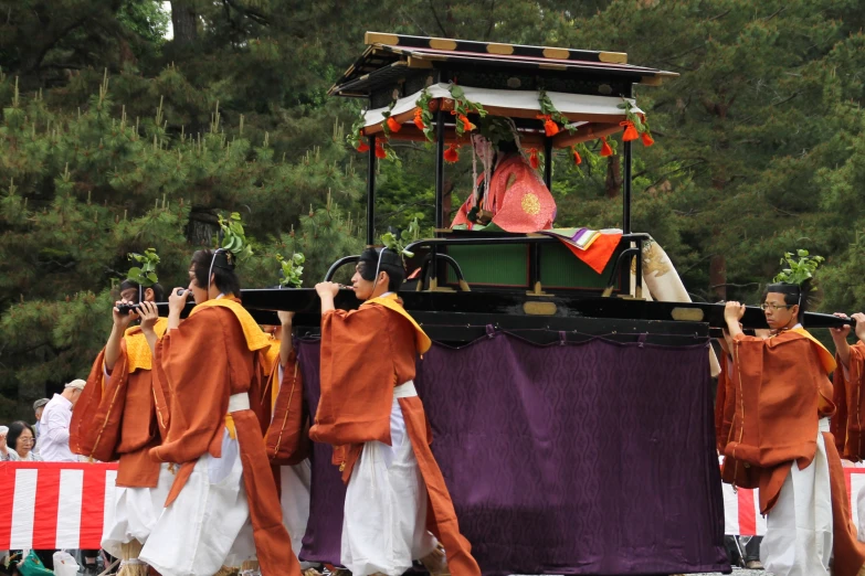 a group of people are riding on a float