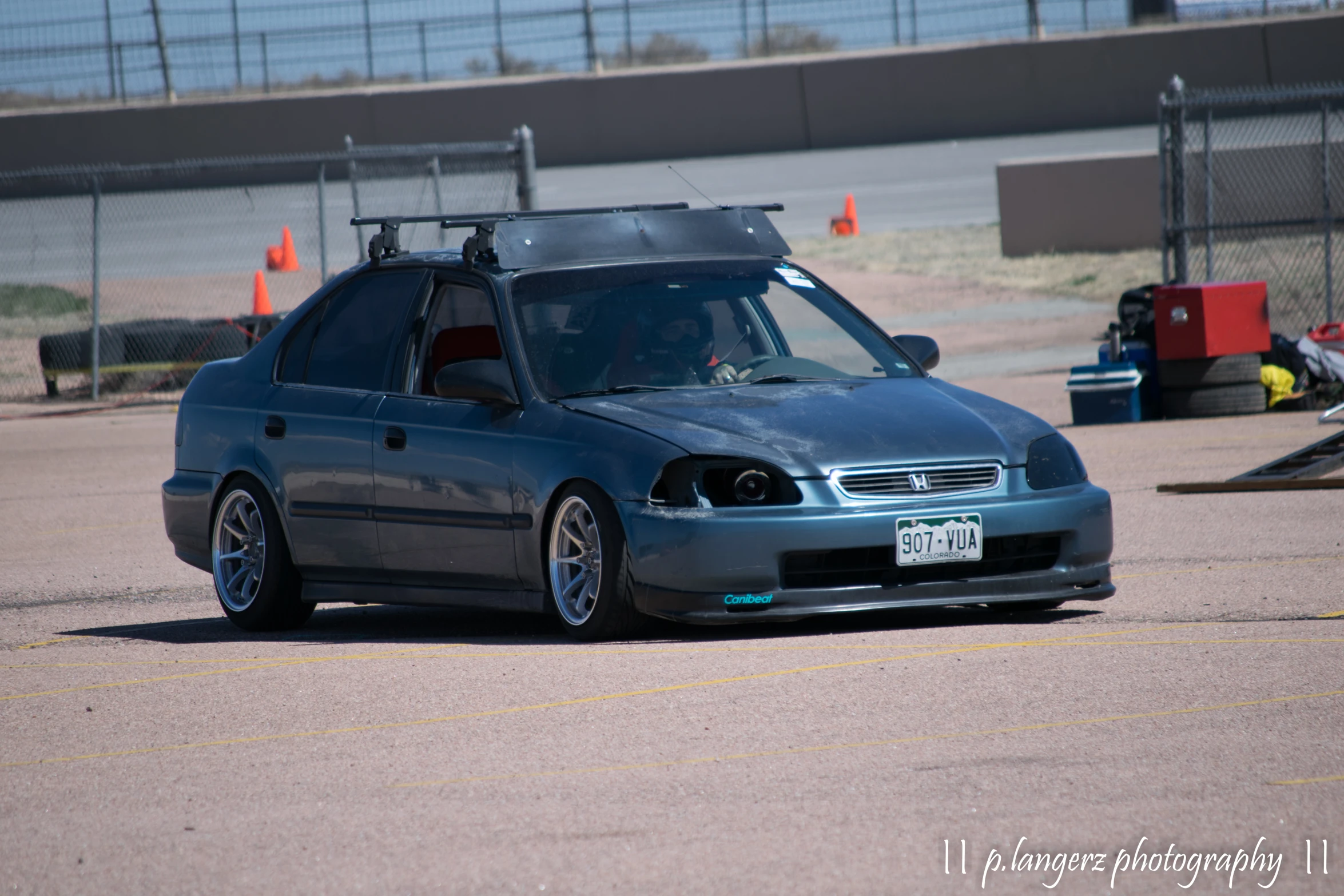 a car that has a light blue front end