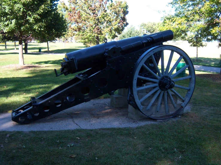 a large cannon on display at the entrance to a park