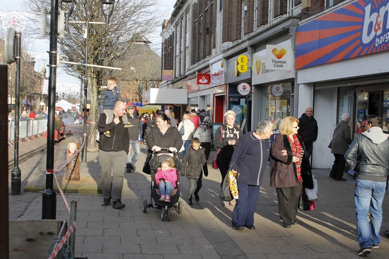 a group of people walking down a street