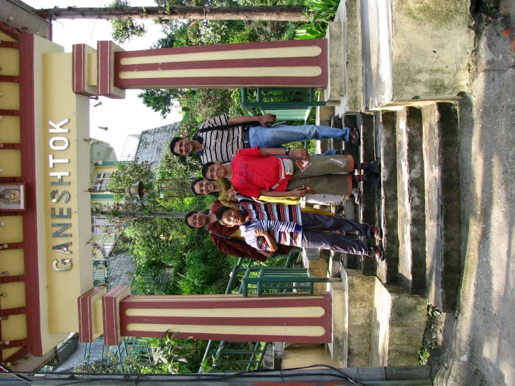 a group of people posing for a picture under a tent