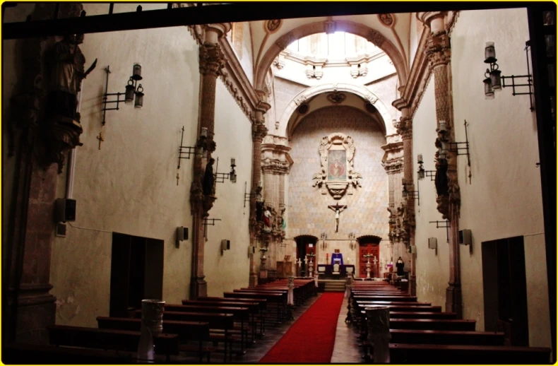 the interior of a church with high vaulted ceilings