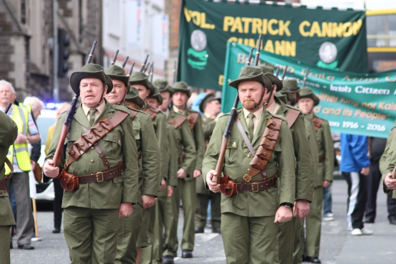 a group of men in army uniforms marching