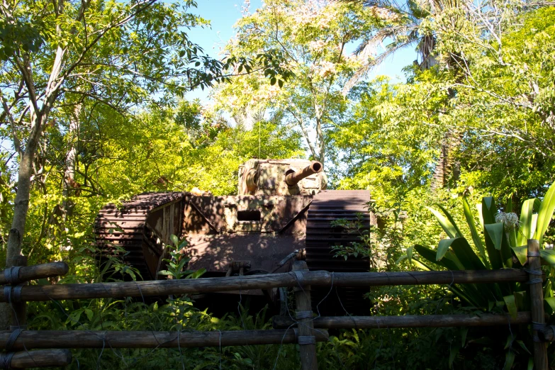 the tank is parked in the forest