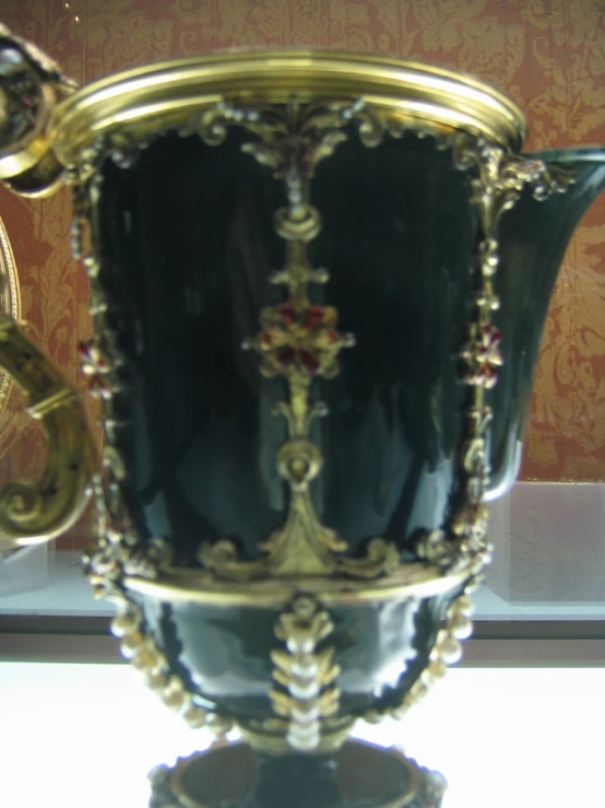 a large ornate cup is on display at the museum