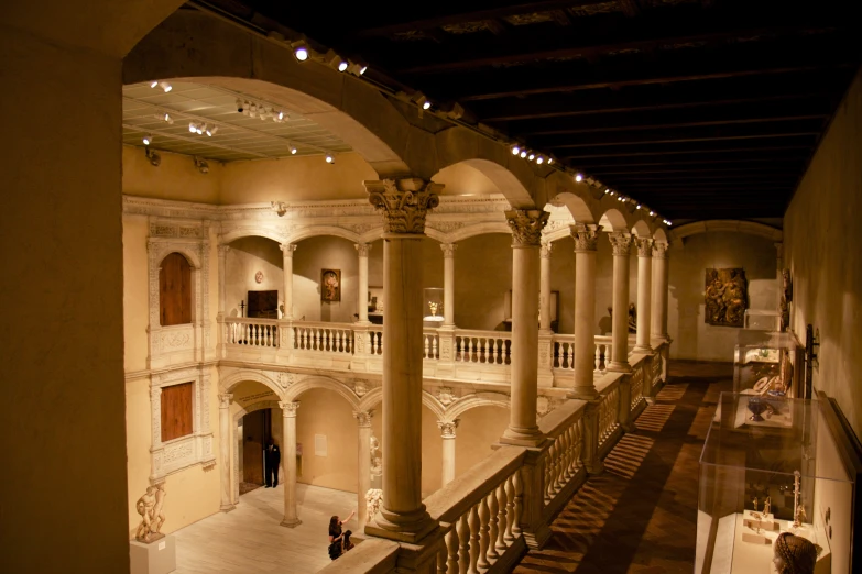 a building with many pillars and white decorations