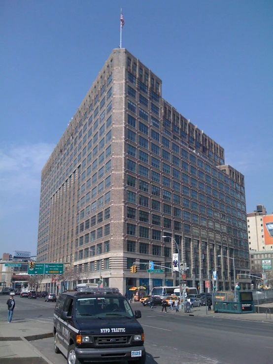 a black car parked in front of the building