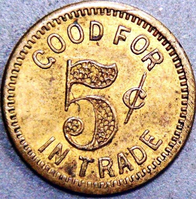 an old five cent coin with the number six on it